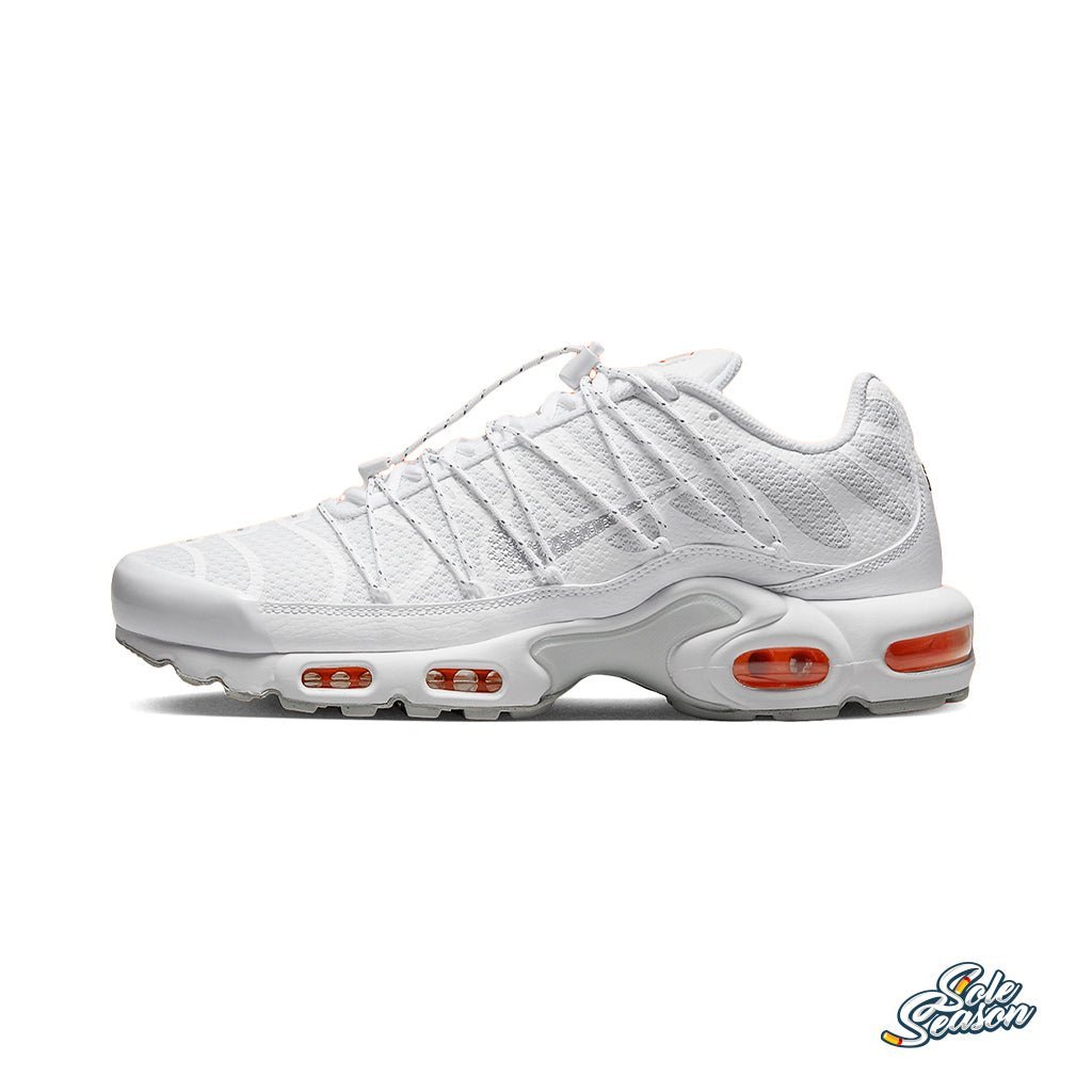 white and orange nike tn