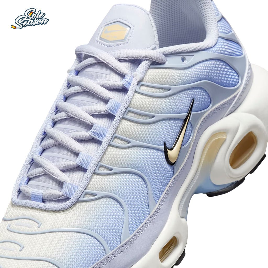 Close up view of Nike TN Daybreak sneakers featuring a soft Dawn blue and Light Lemon Twist colourway with signature Tuned Air sole, displayed on a white background."