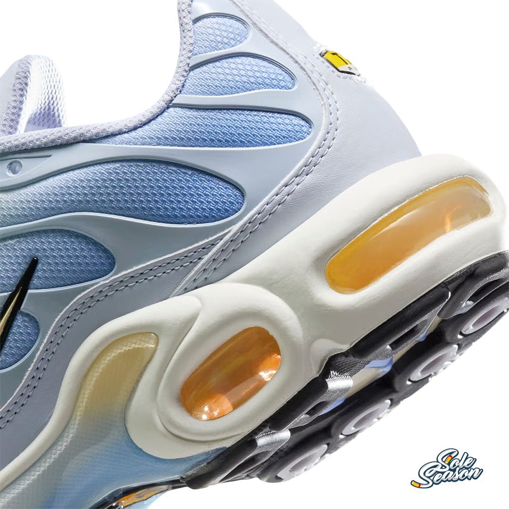 Close up view of Nike TN Daybreak sneakers featuring a soft Dawn blue and Light Lemon Twist colourway with signature Tuned Air sole, displayed on a white background." 2
