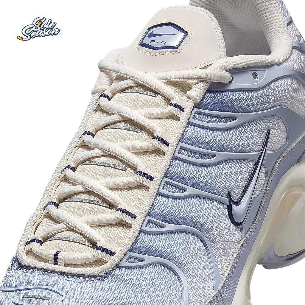 Front angle of the Nike TN 'Sanded Purple' tongue and lacing system, featuring cream laces and stitched detailing with subtle purple accents.