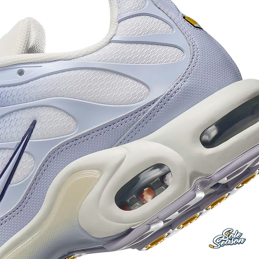 Close-up side view of the Nike TN 'Sanded Purple', showcasing the light blue mesh upper, gradient overlays, and visible Air unit in the sole.