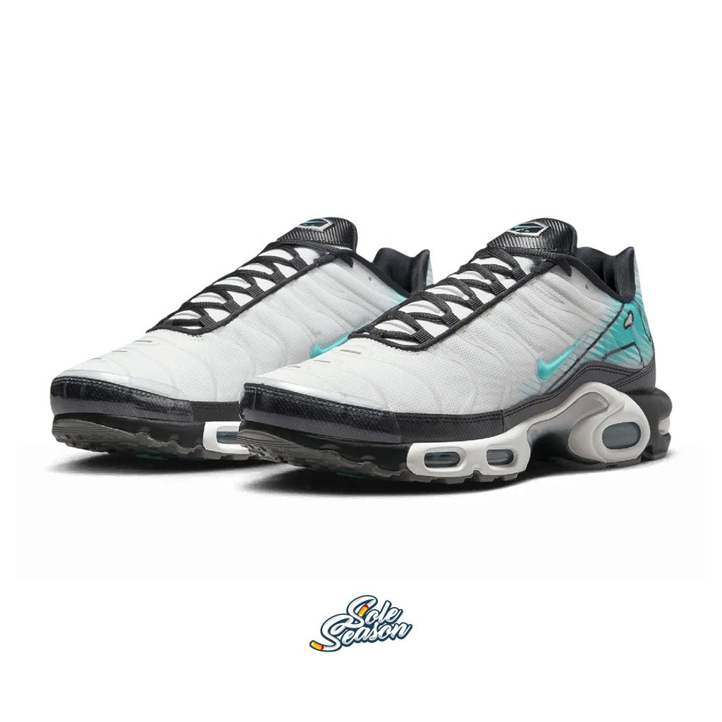 Angled view of the Nike TN Mercurial Vapour pair, highlighting the black, white, and teal colour blocking and glossy toe cap