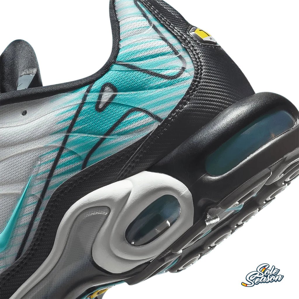 Close-up view of the Nike TN Mercurial Vapour heel showing teal and black gradient with swooping line details and visible Air cushioning.
