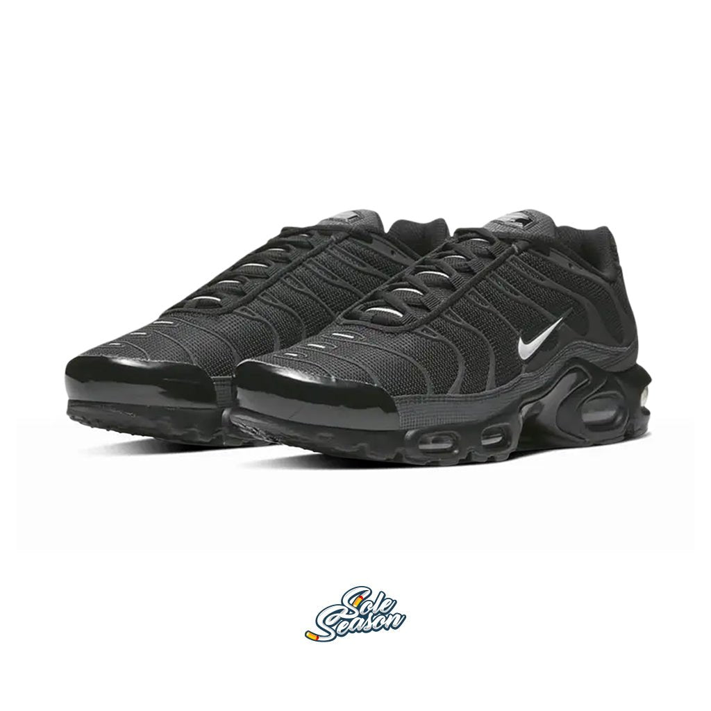 Angled view of Nike TN Black / Pure Platinum 3M with reflective detailing and mesh upper